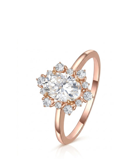 Oval moissanite engagement ring with floral halo and round accents in 18K rose gold | SARATTI