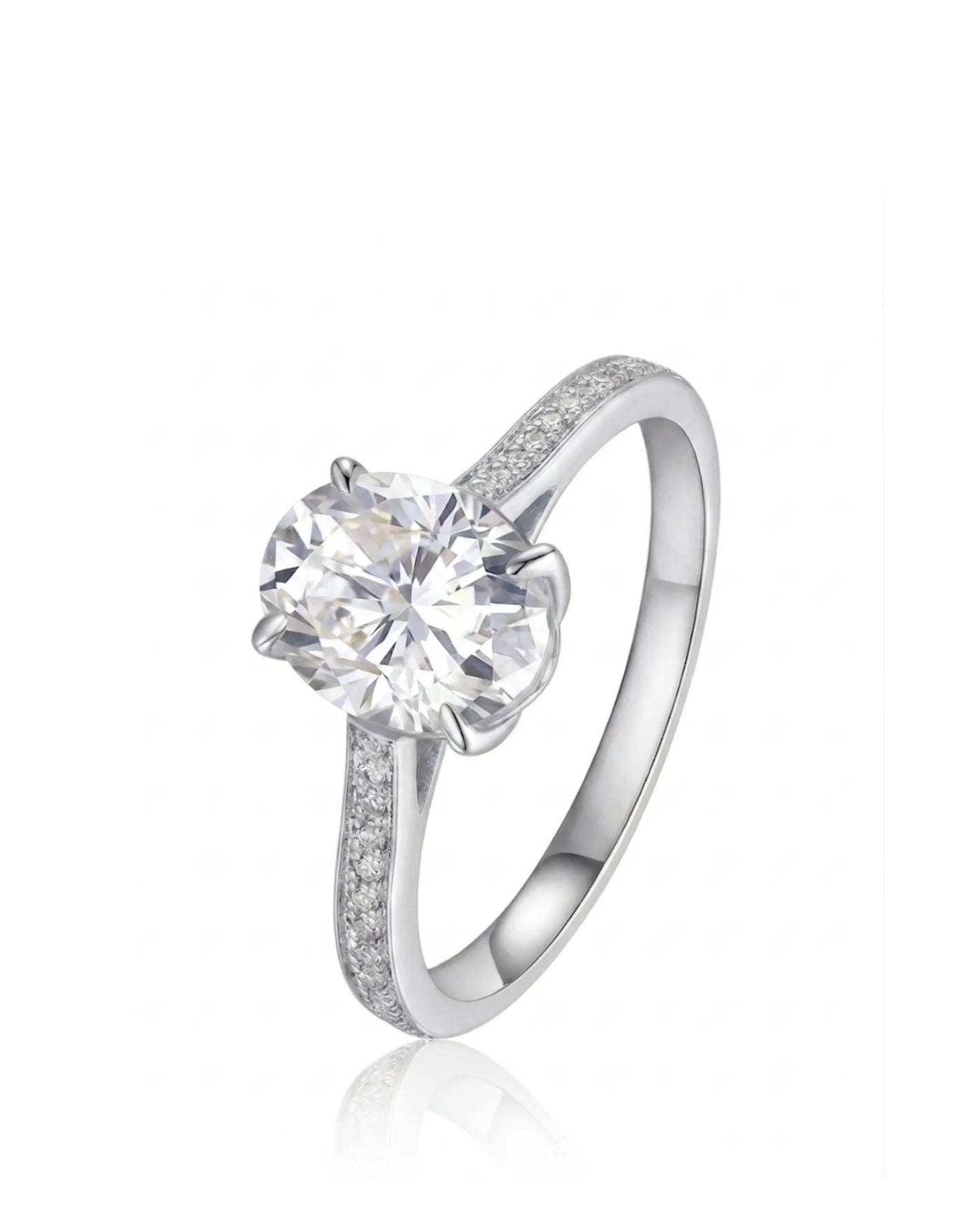 Oval moissanite engagement ring with pavé round side stones crafted in platinum | SARATTI