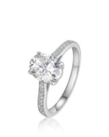 Oval moissanite engagement ring with pavé round side stones crafted in platinum | SARATTI