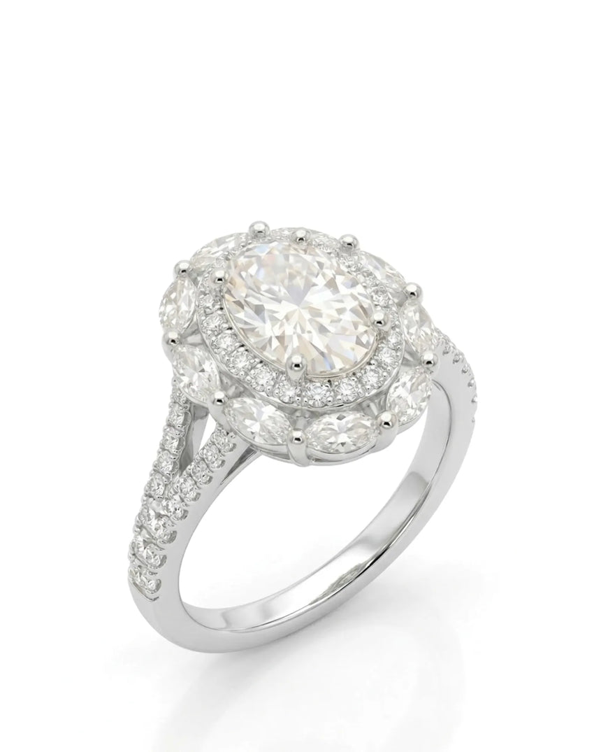Oval moissanite engagement ring with round halo, marquise accents, and split shank in 18K white gold | SARATTI