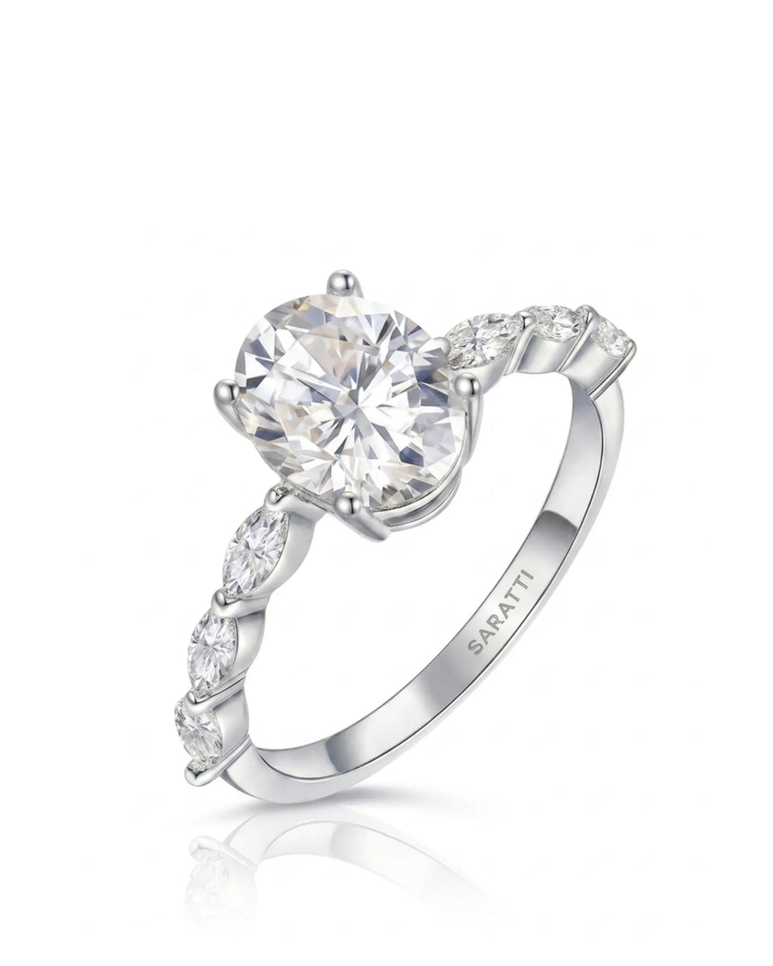 Oval moissanite engagement ring with six marquise side stones and hidden halo in 18K white gold | SARATTI