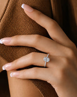 Oval moissanite ring in platinum with four-prong crown and discreet hidden halo | SARATTI