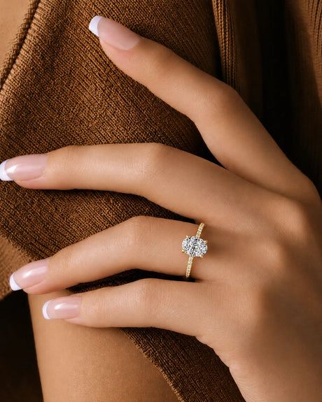 Oval moissanite ring in yellow gold with four-prong crown and hidden halo | SARATTI