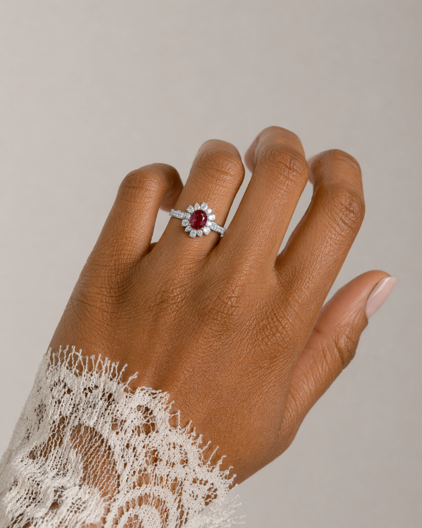 Oval natural ruby and diamond flower ring in Platinum | SARATTI