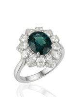 Oval natural sapphire ring with floral diamond halo in 18K white gold | SARATTI