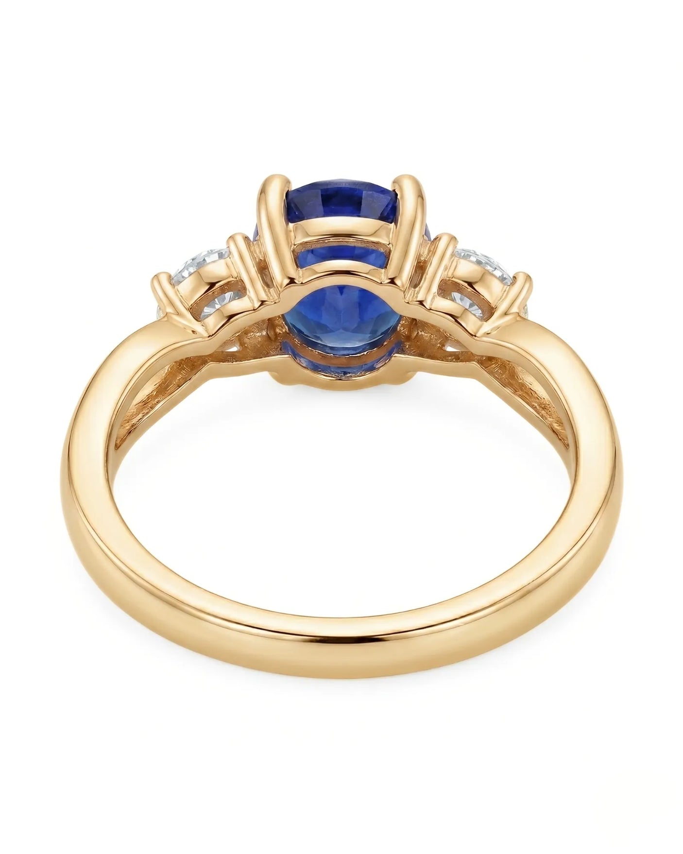 Oval natural sapphire ring with round side diamonds in 18K yellow gold | SARATTI