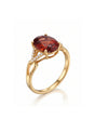 Oval orange garnet ring with diamond frame in 18K yellow gold | SARATTI