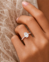 Oval pavé moissanite engagement ring for a romantic proposal in 18K rose gold | SARATTI