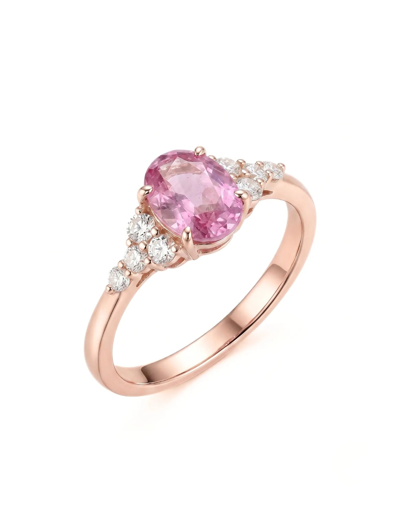 Oval pink sapphire ring with round diamond side stones in 18K rose gold | SARATTI