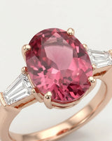 Oval pink tourmaline ring with emerald-cut diamond side stones in 18K rose gold | SARATTI