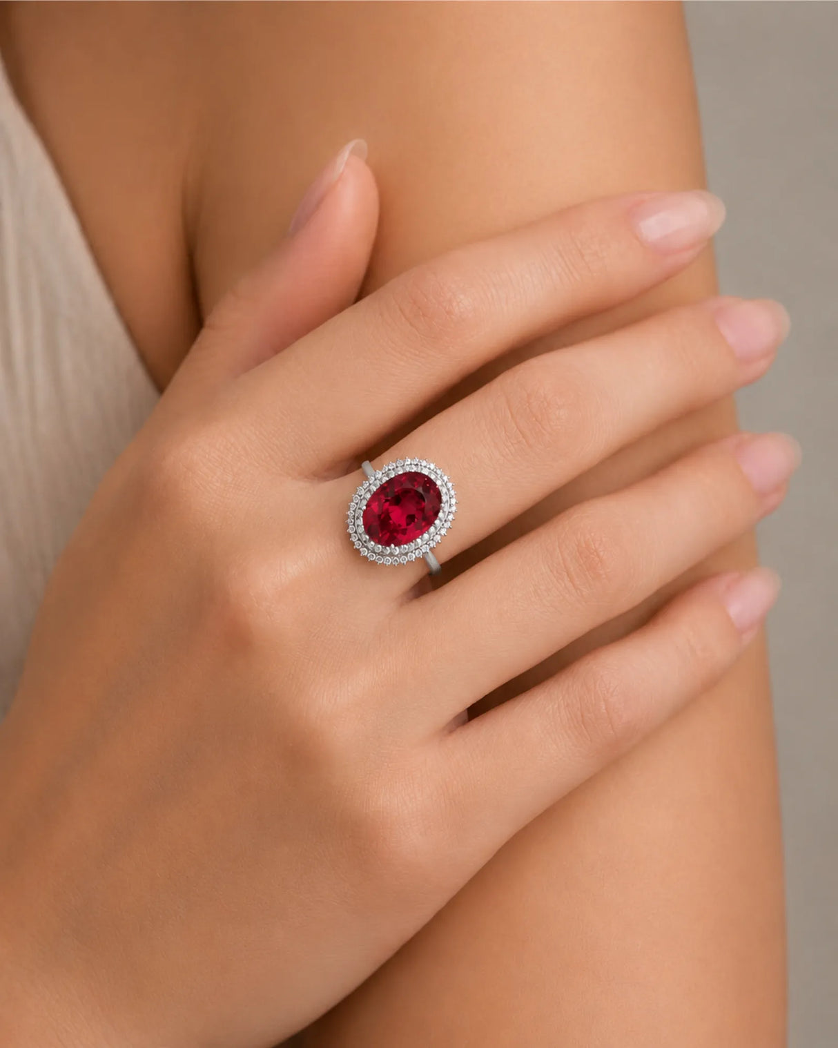 Oval red rubellite tourmaline ring with sparkling diamond accents in 18K white gold | SARATTI