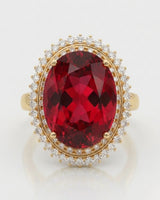 Oval red rubellite tourmaline ring with sparkling diamond accents in 18K yellow gold | SARATTI