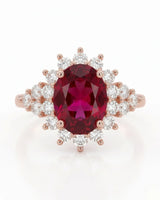 Oval reddish pink tourmaline ring with sparkling diamond accents in warm 18K rose gold | SARATTI