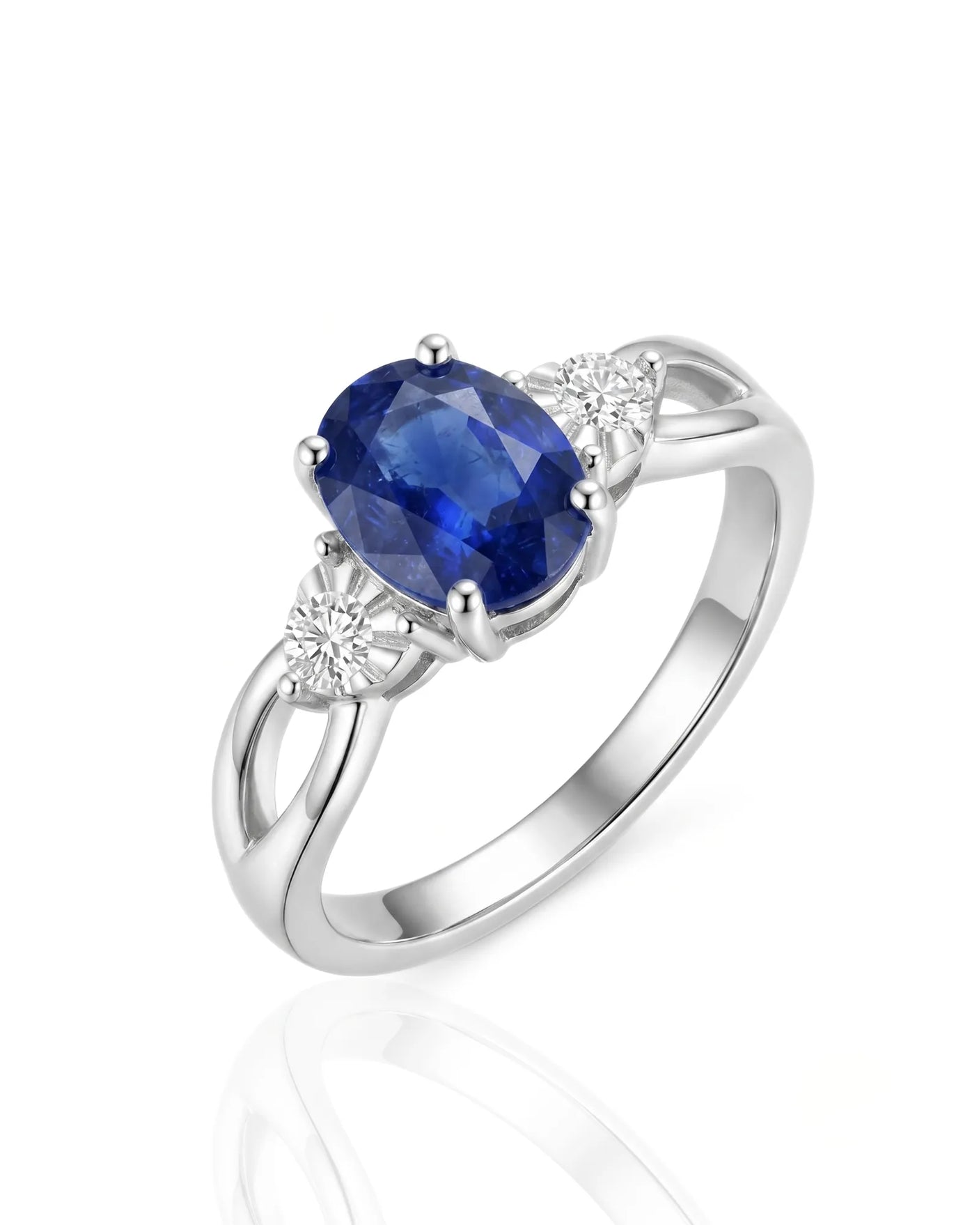 Oval royal blue sapphire and diamond three stone ring in platinum | SARATTI