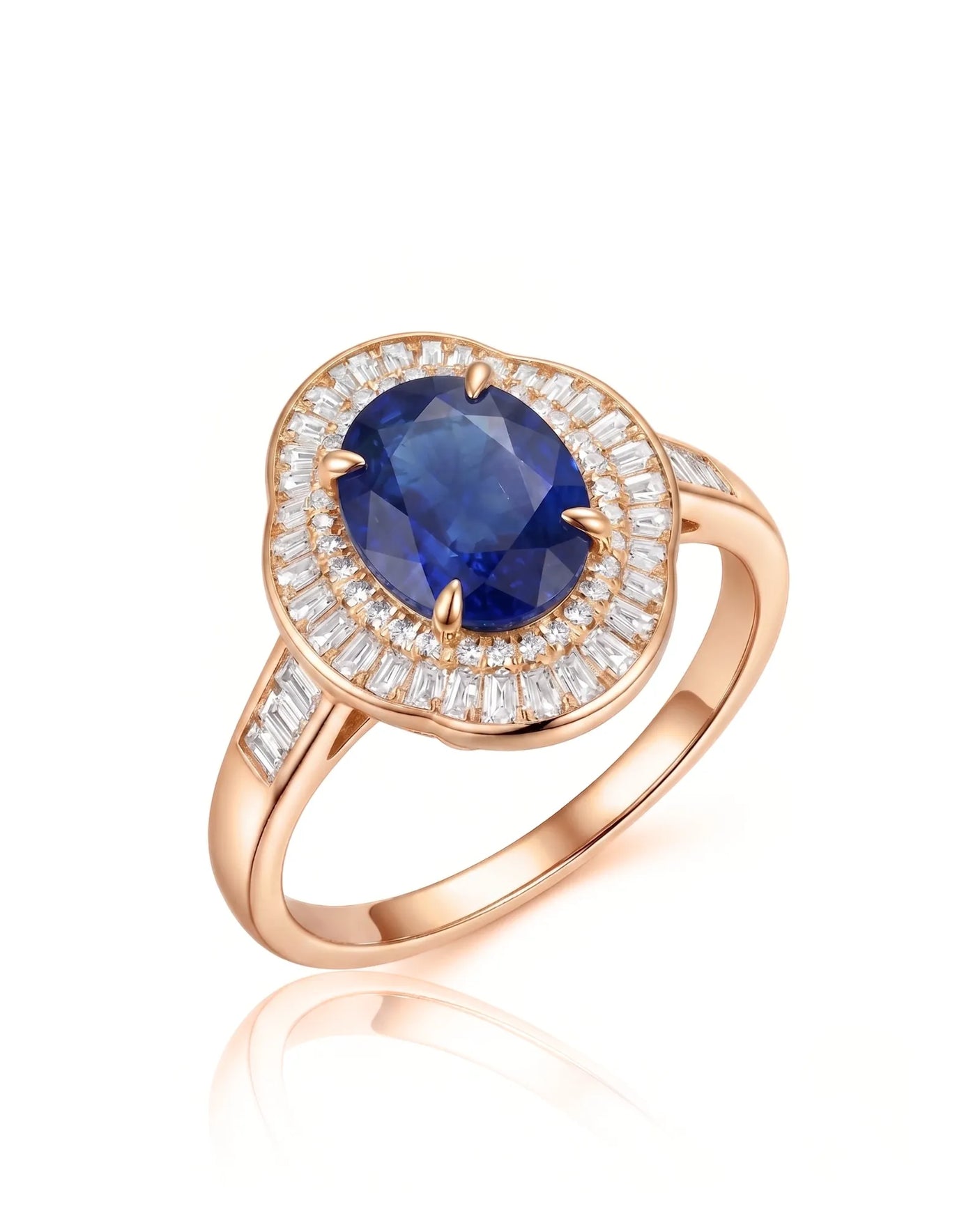 Oval royal blue sapphire ring with baguette diamond sunburst halo in 18K rose gold | SARATTI