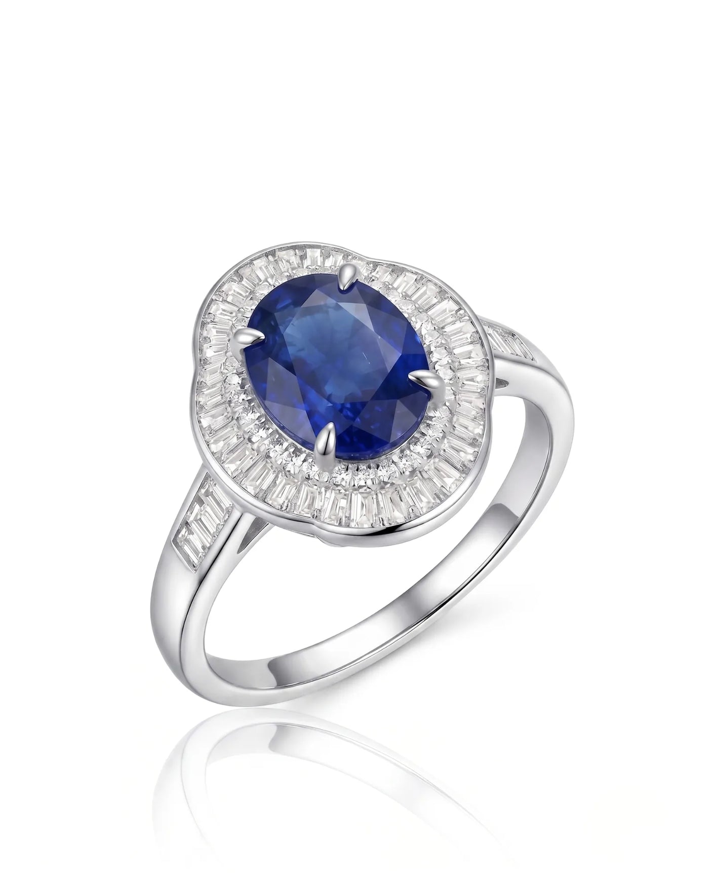 Oval royal blue sapphire ring with baguette diamond sunburst halo in 18K white gold | SARATTI