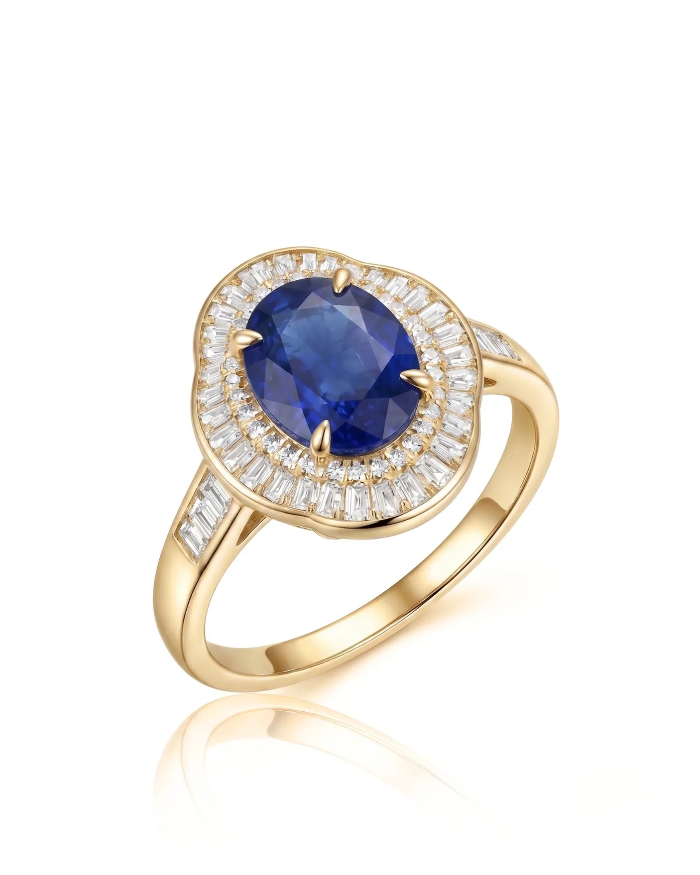 Oval royal blue sapphire ring with baguette diamond sunburst halo in 18K yellow gold | SARATTI