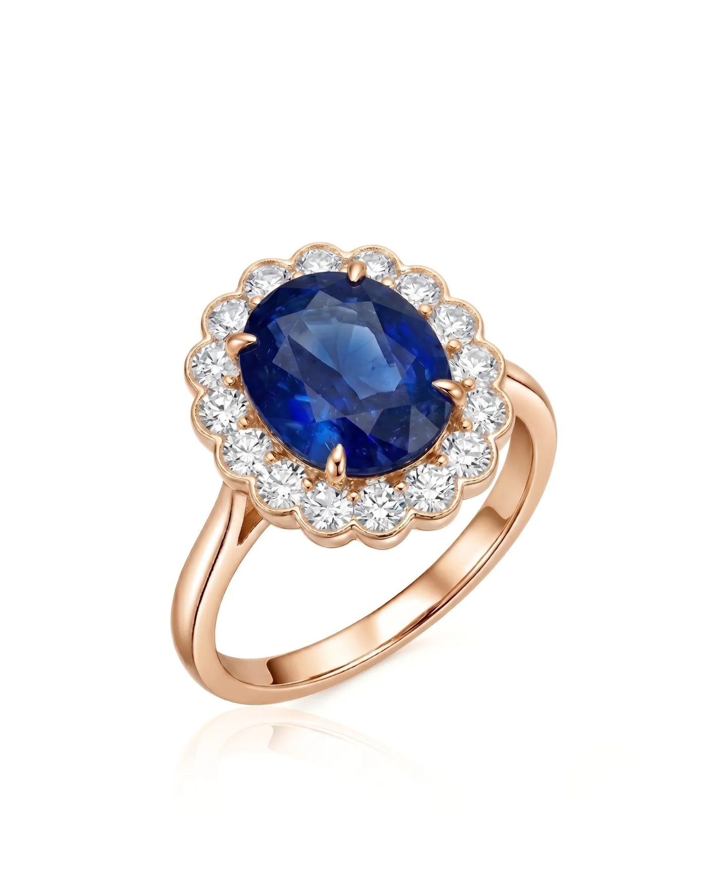Oval royal blue sapphire ring with round diamond floral halo in 18K rose gold | SARATTI