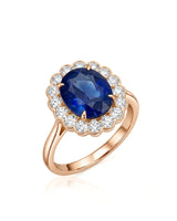 Oval royal blue sapphire ring with round diamond floral halo in 18K rose gold | SARATTI