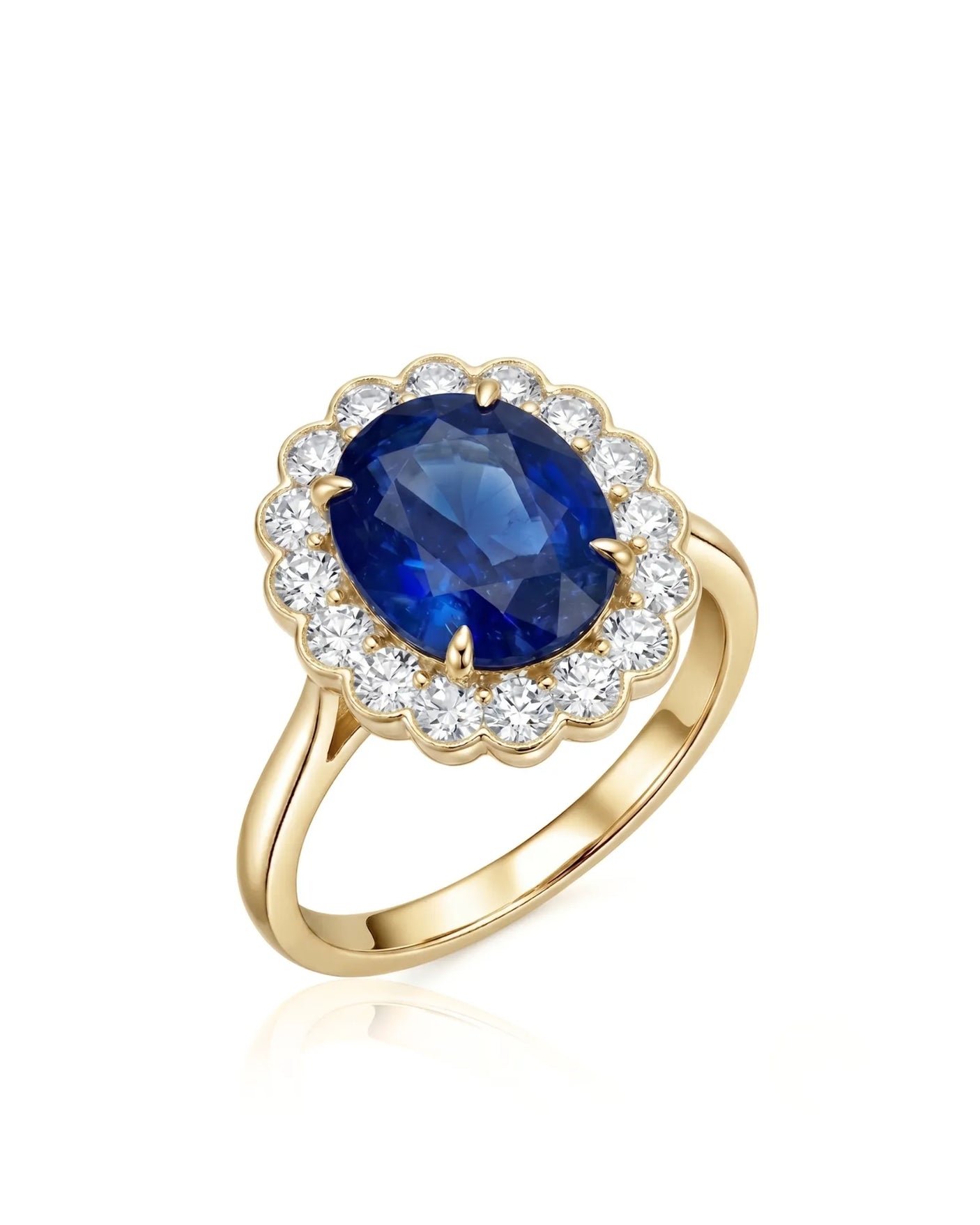 Oval royal blue sapphire ring with round diamond floral halo in 18K yellow gold | SARATTI