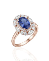 Oval royal blue sapphire ring with round diamond halo in 18K rose gold | SARATTI