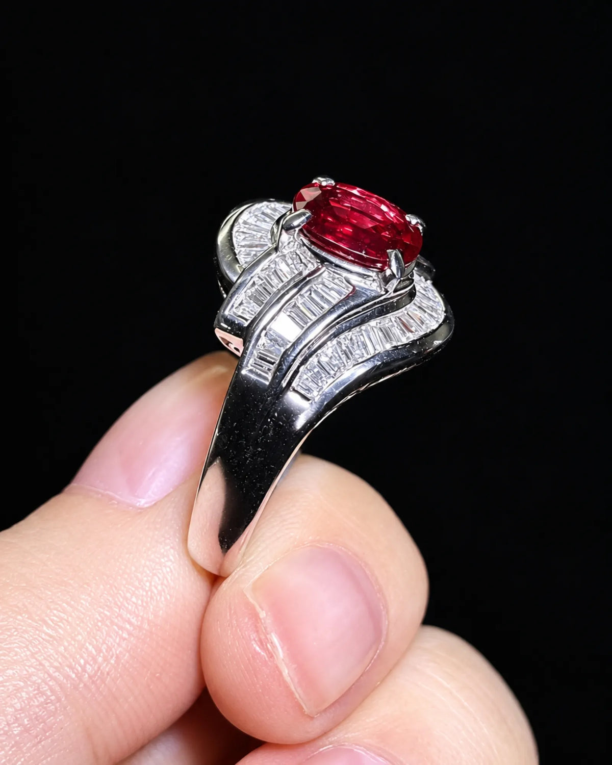 Oval ruby diamond ring in platinum with four-prong centre and architectural wave setting - SARATTI