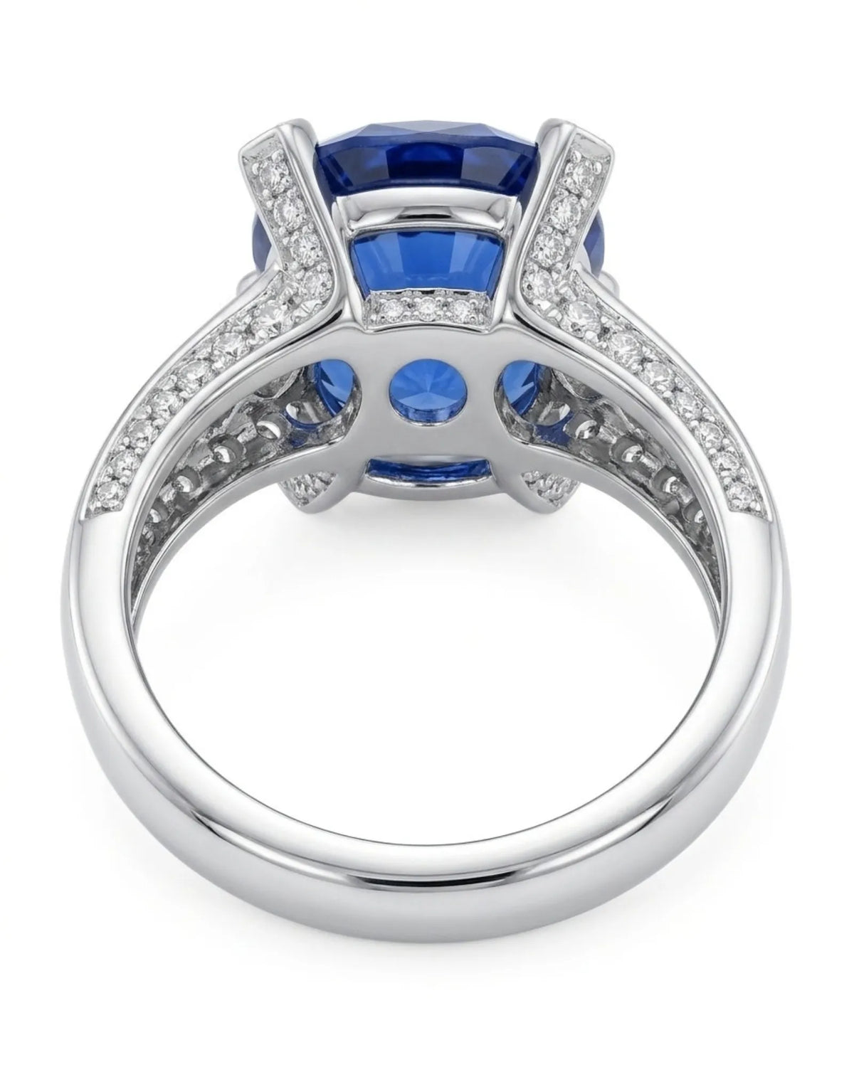 Oval sapphire statement ring with diamond-set prongs and pavé shoulders in platinum - SARATTI
