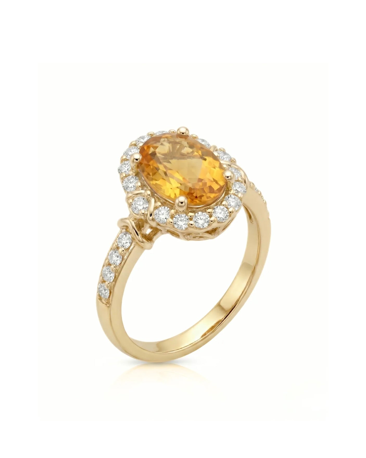 Oval yellow sapphire ring with diamond halo and shoulder accents in 18K yellow gold | SARATTI