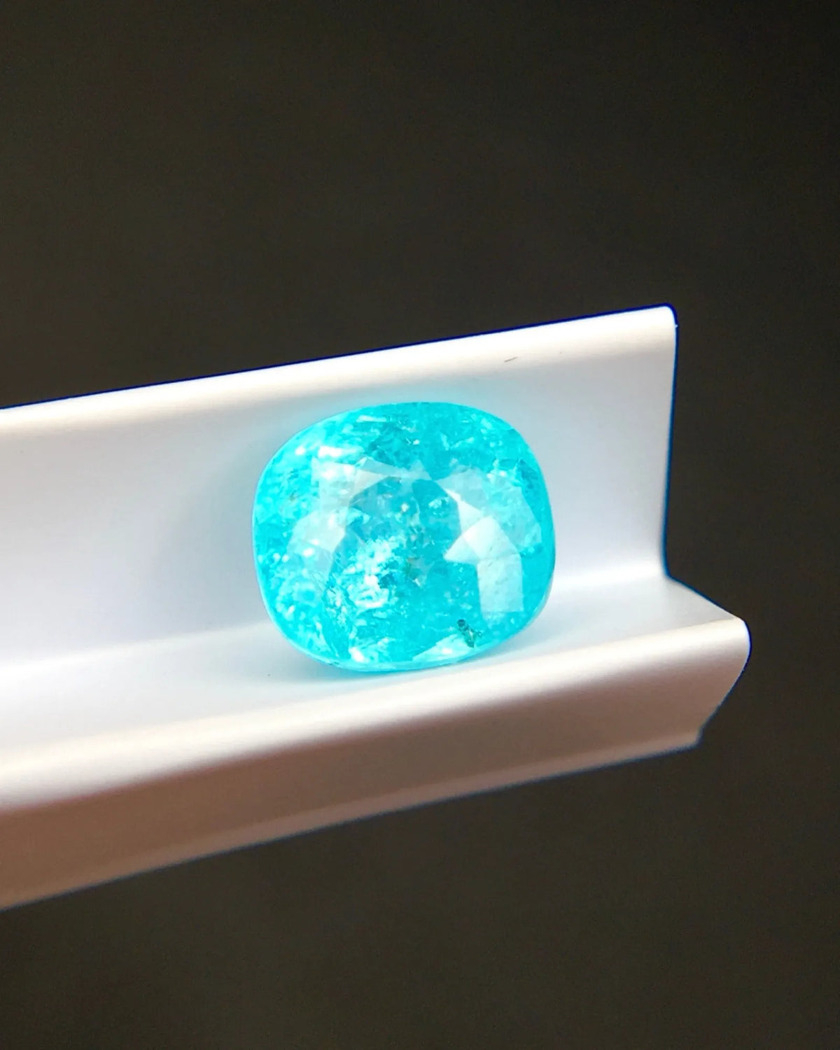 Paraiba-Type Tourmaline cushion with rounded corners and faceted surface | SARATT