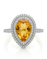 Pear-cut citrine ring with layered diamond framing and sculpted 18K white gold gallery | SARATTI