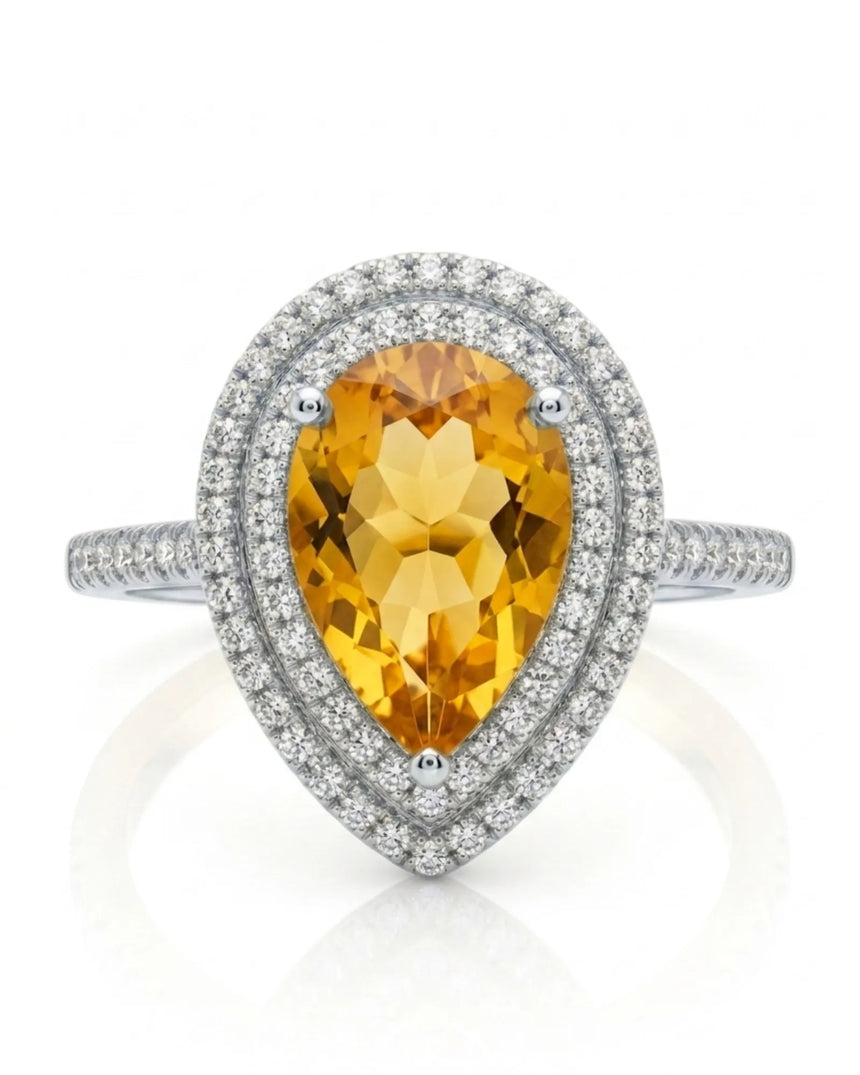 Pear-cut citrine ring with layered diamond framing and sculpted 18K white gold gallery | SARATTI