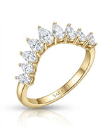 Pear-shaped diamond wedding band with brilliant gemstones arranged across a curved 18K yellow gold setting | SARATTI