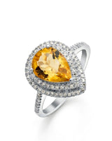 Pear-shaped natural citrine ring with double diamond halo and pavé band in polished platinum | SARATTI
