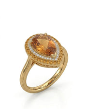 Pear cut Natural Imperial Topaz double halo setting in 18K yellow gold | SARATTI