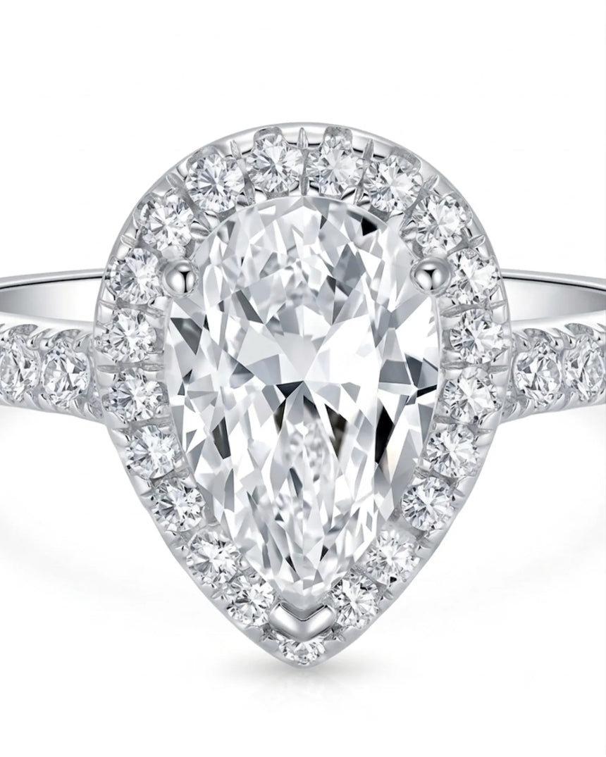 Pear halo moissanite engagement ring designed for an elegant proposal in enduring platinum | SARATTI