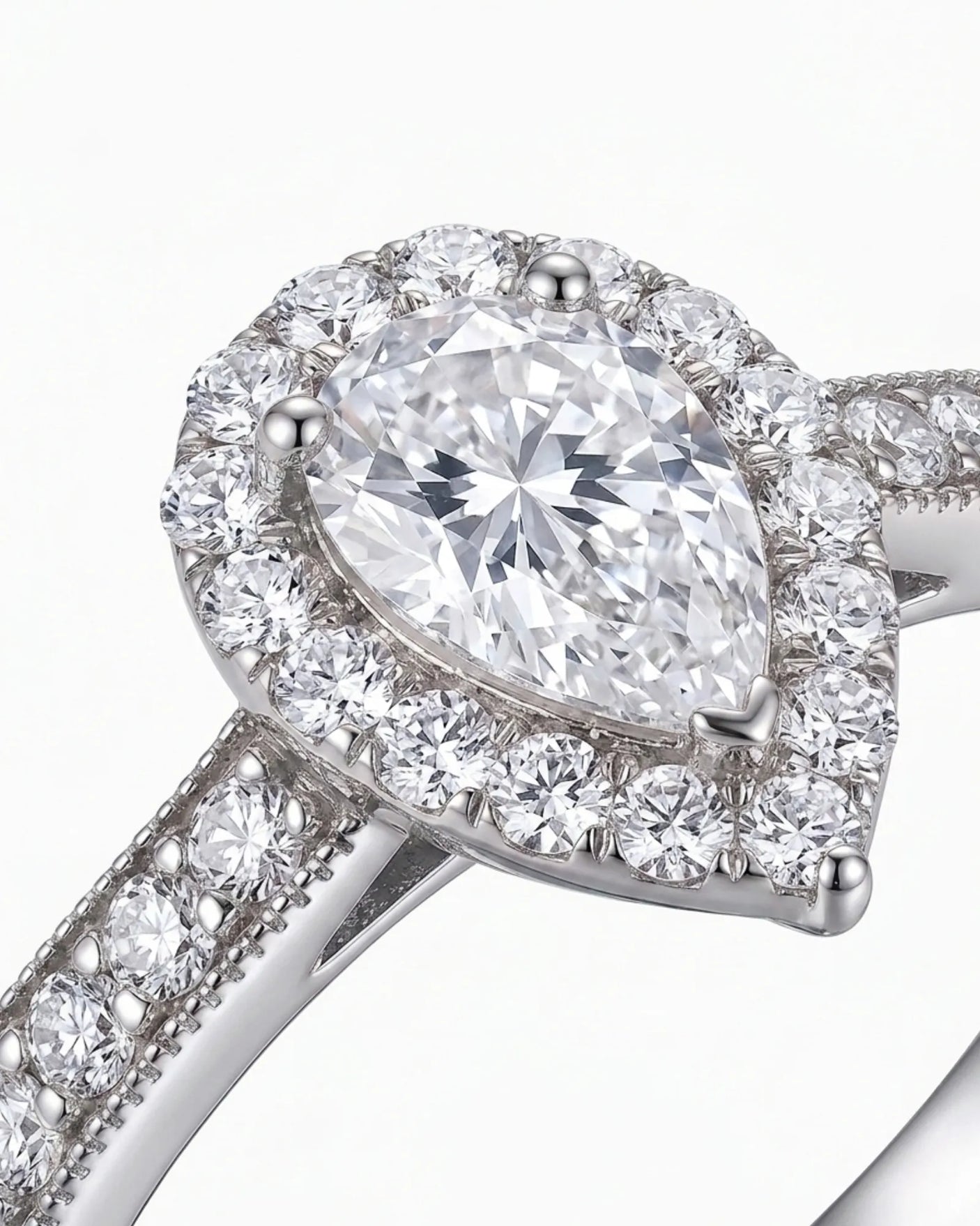 Pear halo moissanite engagement ring for a graceful proposal in 18K white gold | SARATTI