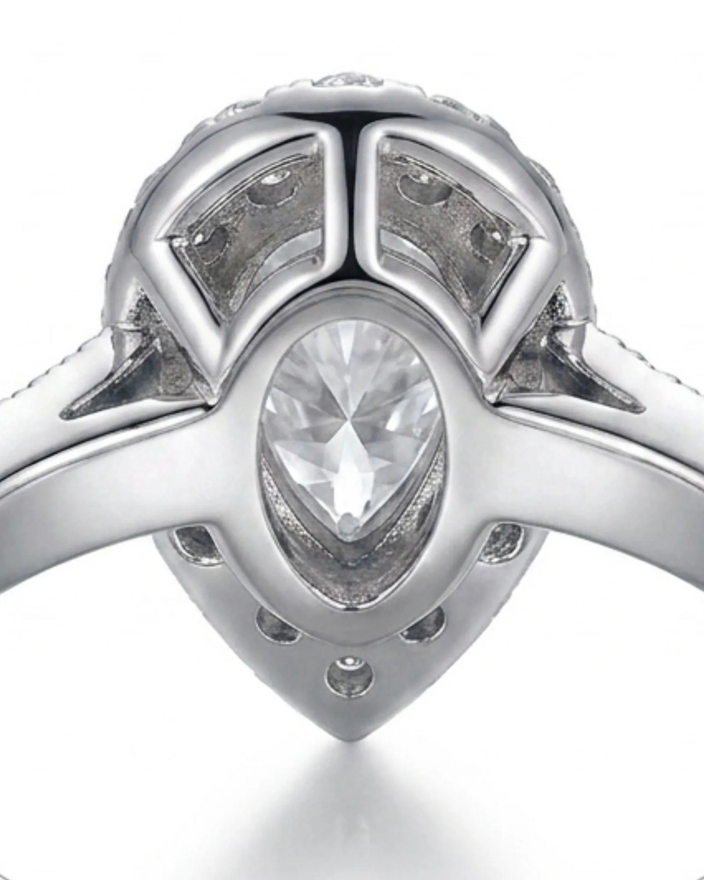 Pear halo moissanite engagement ring for a refined proposal crafted in platinum | SARATTI
