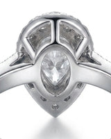 Pear halo moissanite engagement ring for a refined proposal crafted in platinum | SARATTI