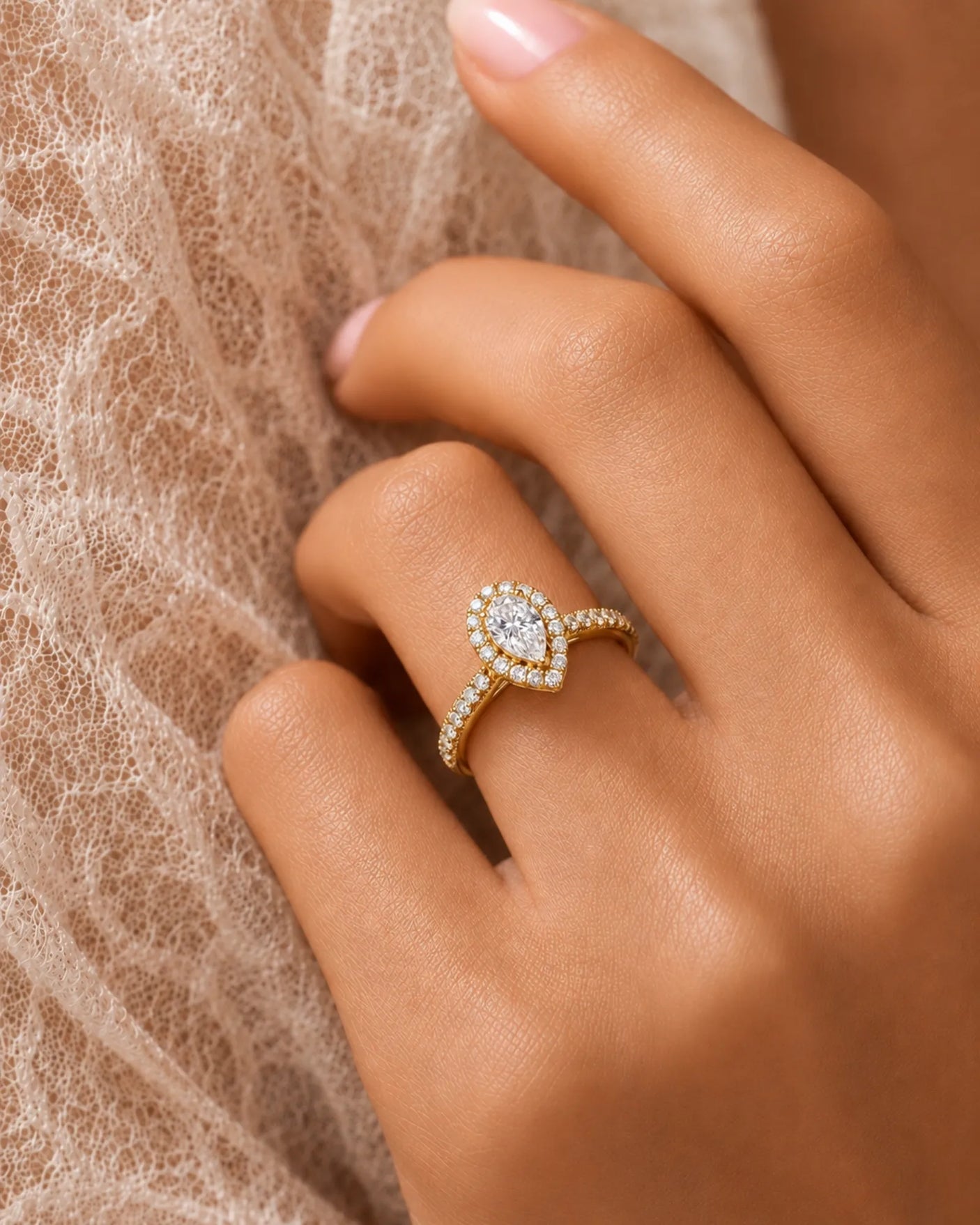 Pear halo moissanite engagement ring for a warm graceful proposal in yellow gold | SARATTI