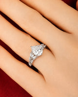 Pear moissanite engagement ring in white gold with marquise leaf accents and refined elegance | SARATTI