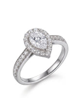 Pear moissanite engagement ring with round halo and pavé band crafted in platinum | SARATTI
