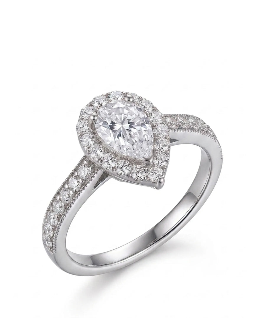 Pear moissanite engagement ring with round halo and pavé band in 18K white gold | SARATTI