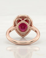 Pear red-pink tourmaline ring with double diamond halo in 18K rose gold | SARATTI