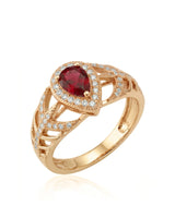 Pear ruby ring with diamond halo and split shank in 18K yellow gold | SARATTI