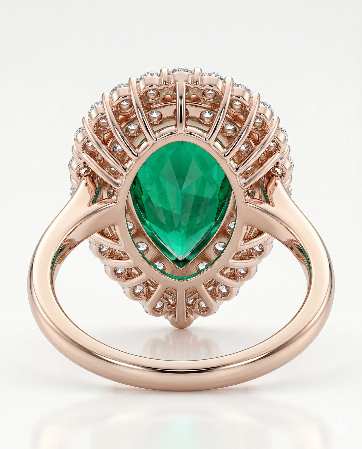 Pear shaped emerald halo ring in 18K rose gold | SARATTI

