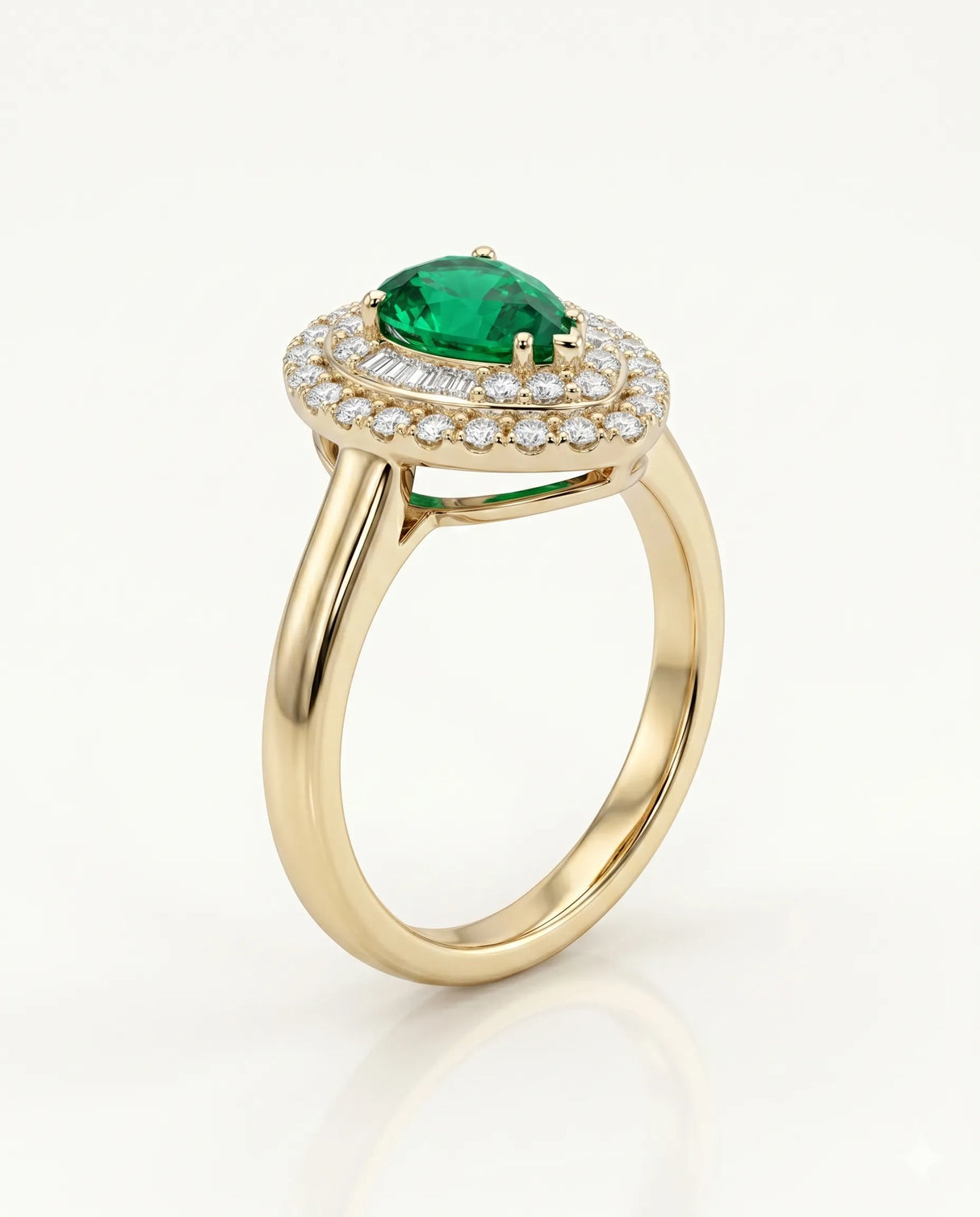 Pear shaped emerald halo ring in 18K yellow gold | SARATTI
