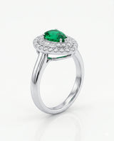 Pear shaped emerald halo ring in platinum | SARATTI
