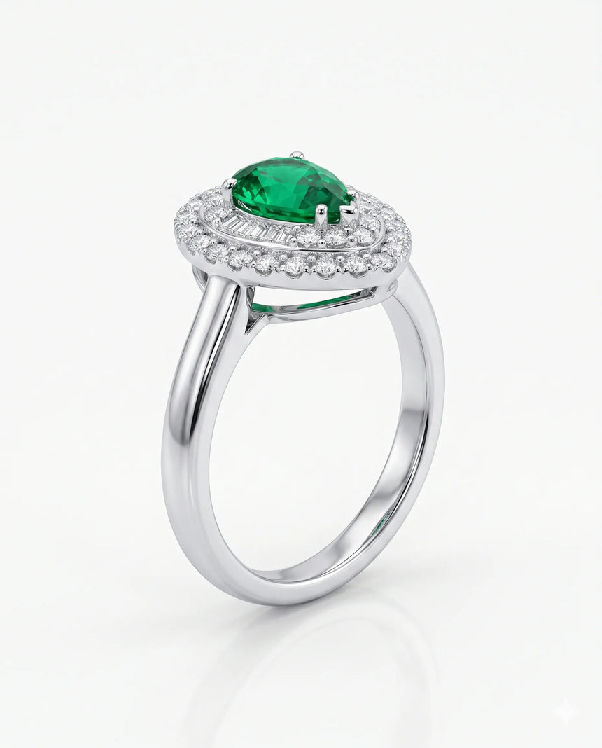 Pear shaped emerald halo ring in platinum | SARATTI
