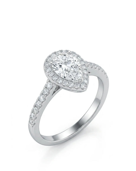 Pear shaped moissanite engagement ring with round halo and pavé shoulders in 18K white gold | SARATTI