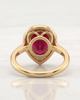 Pear tourmaline engagement ring with double diamond halo in 18K yellow gold | SARATTI